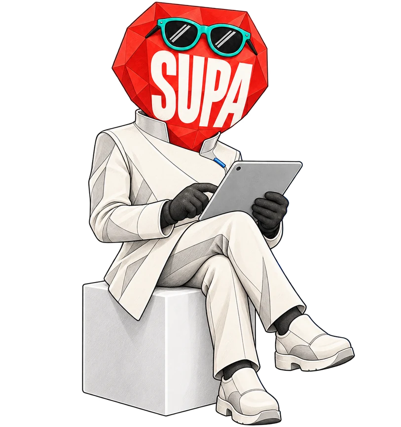 Supa sitting on a cube, checking tasks on a tablet